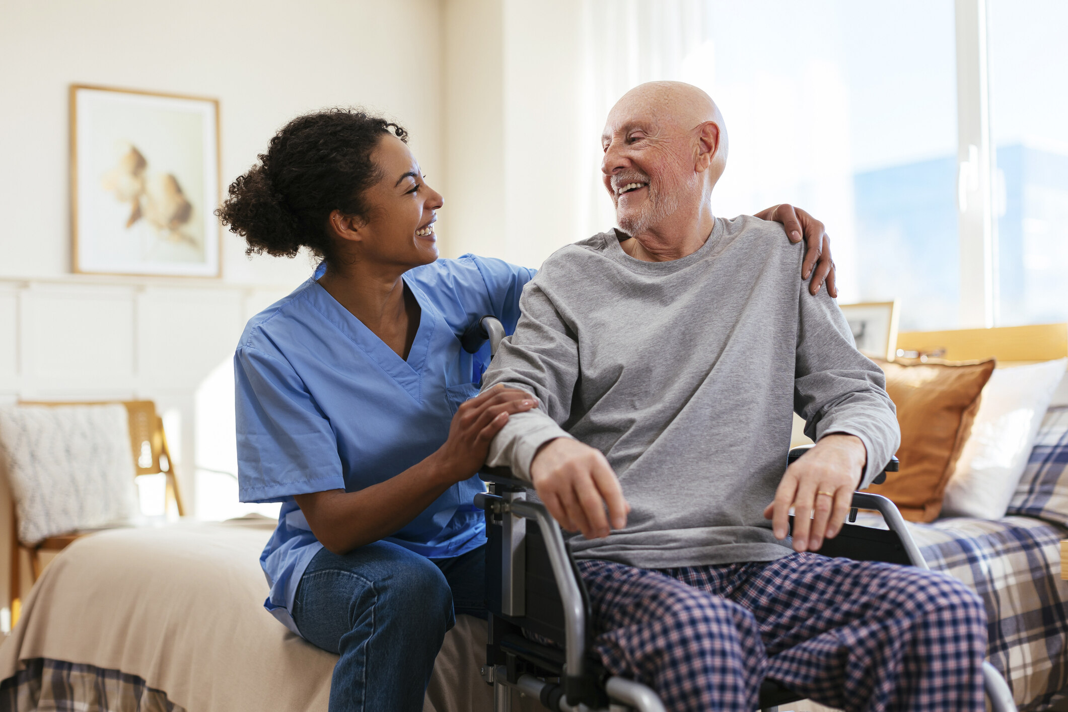 caregiver smiling at man