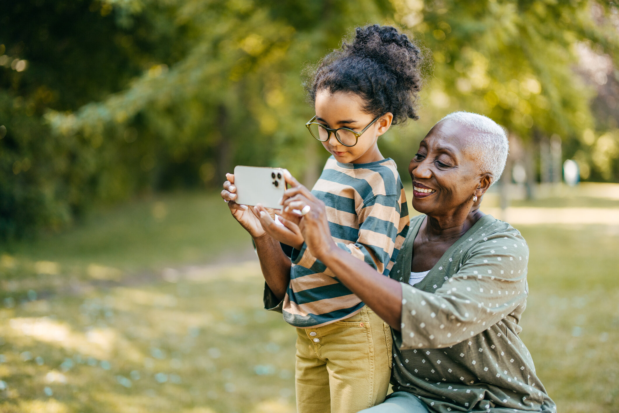 grandchild and grandmother with ipad