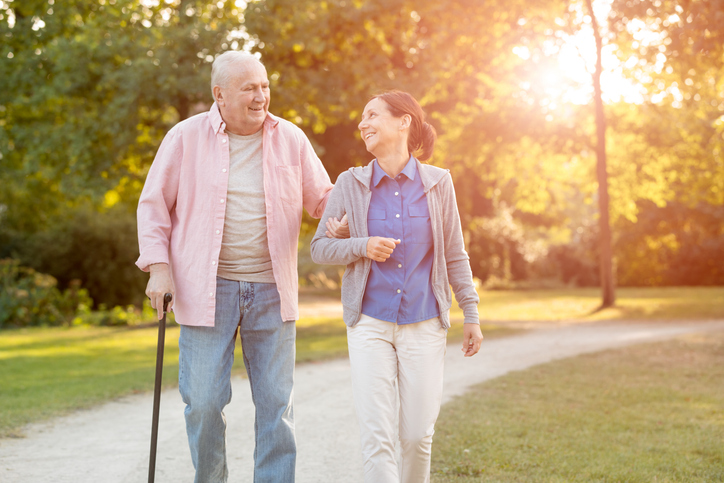 older adult walking with daughter