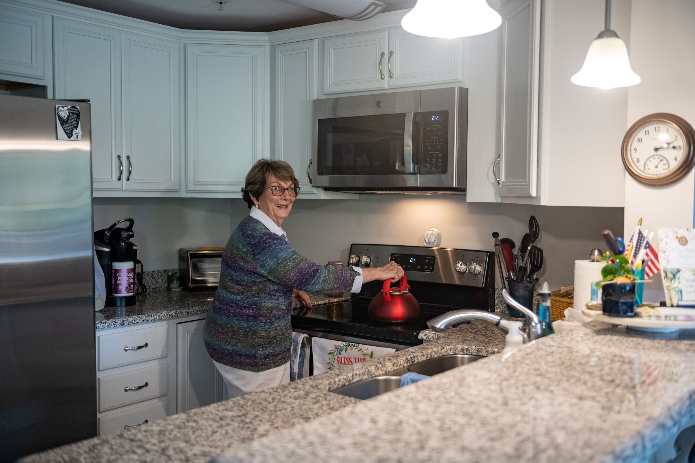 female senior in kitchen