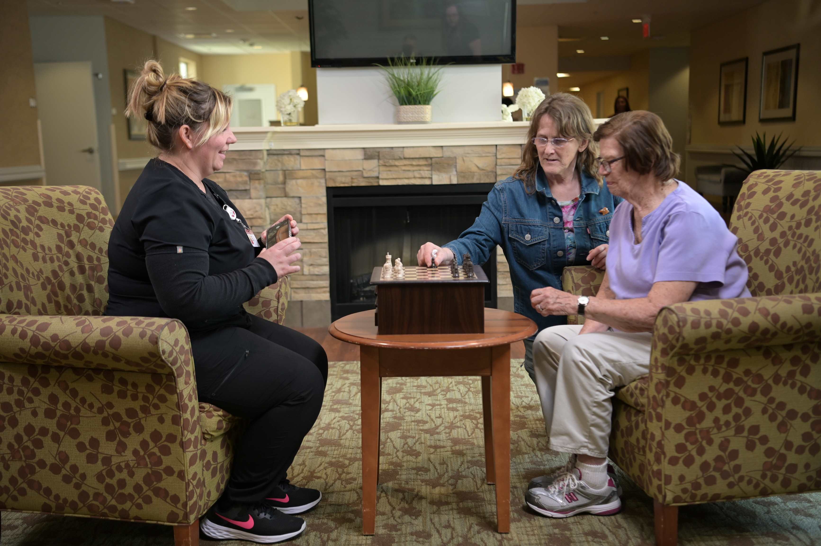 ladies in heart room playing chess